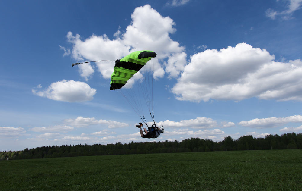 Man preparing for high speed landing while swooping.