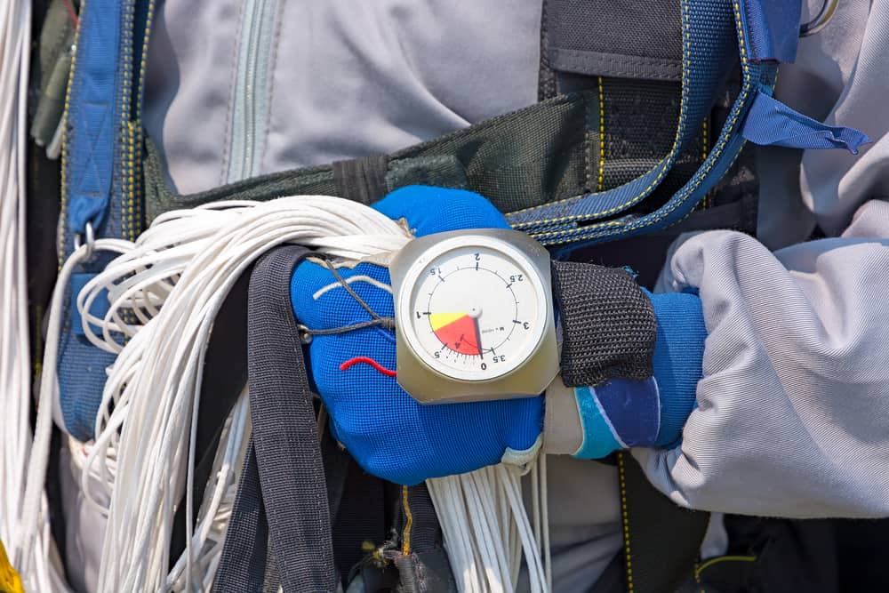 Glove with the parachutists altimeter close up.