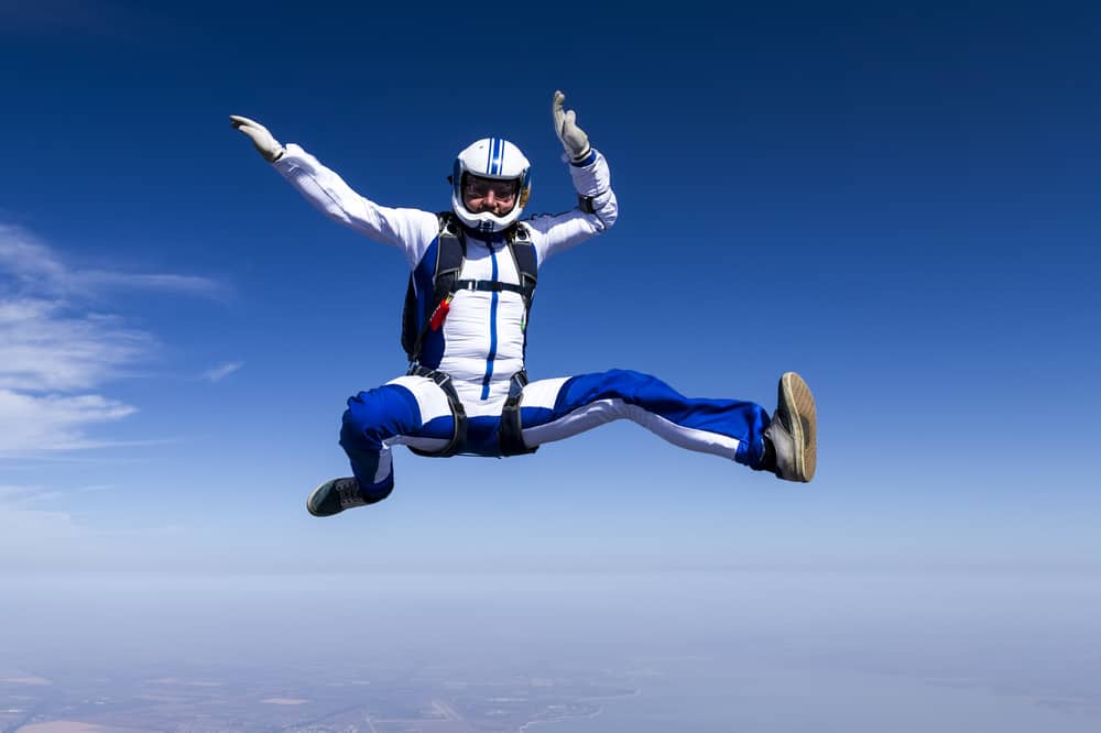 Skydiver in jumpsuit in mid-air.