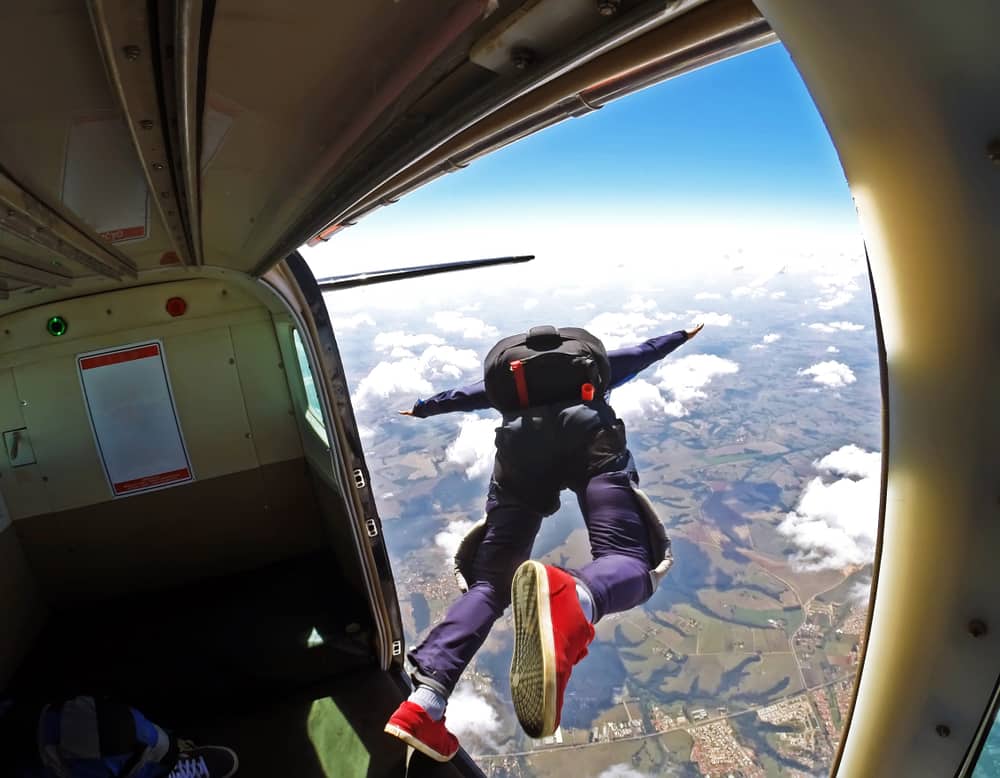 Skydiver jumping out of a plane